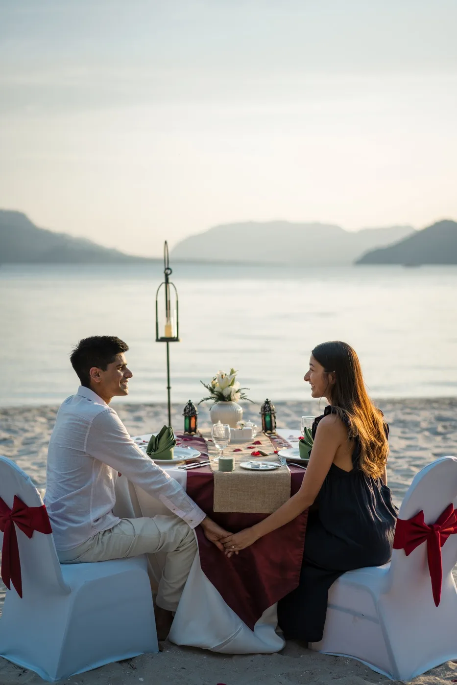 Alisha and Kunal sharing a candlelit dinner by the lake